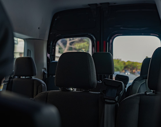 lady stepping out of 15 passenger van